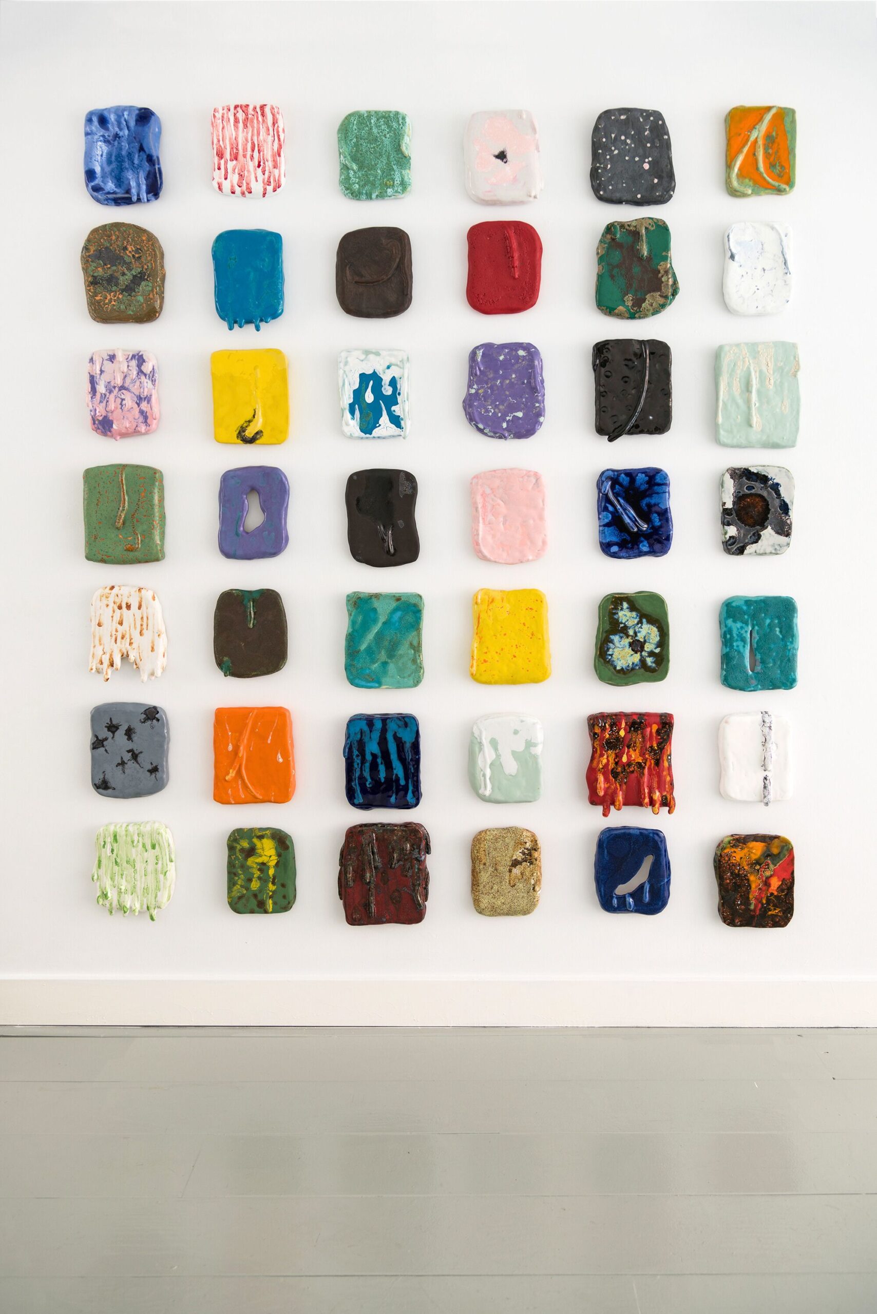 Esterism predictions (54 pieces), (2024) Glazed ceramic painting - 25 x 20 x 4 cm each