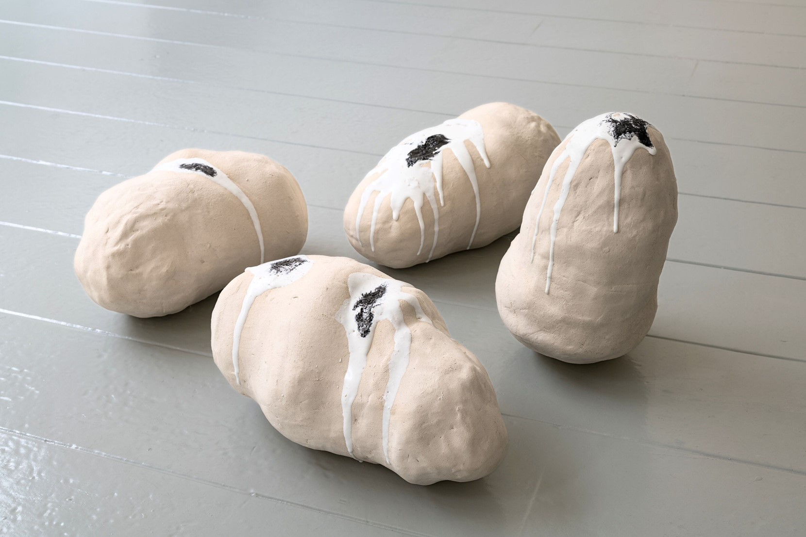 Installation close up, The Orphic eggs. (Burnt ceramic bisque with glazed drips, 30 x 15 x 15 cm