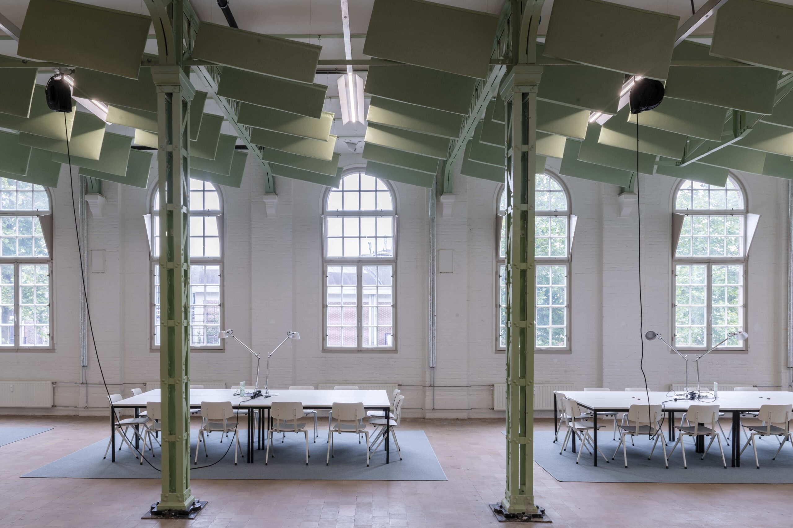 In Obliques, 2024, acoustic ceiling panels tilted 14 degrees, dimensions variable