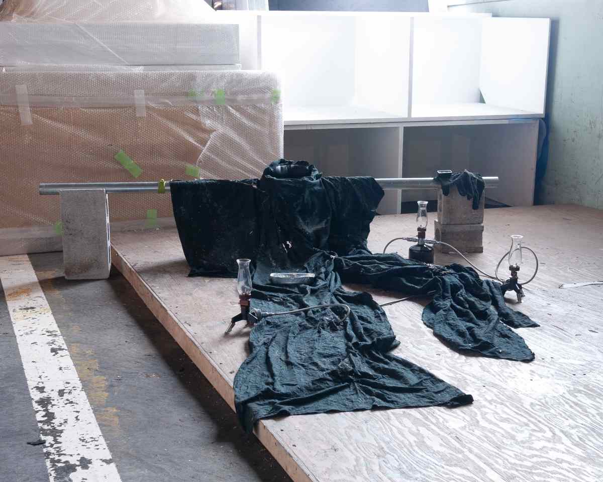 SKIN (#2), [2025] textile, doll eyes, baseball mask, wax, sulfurous clay, candles, various media.