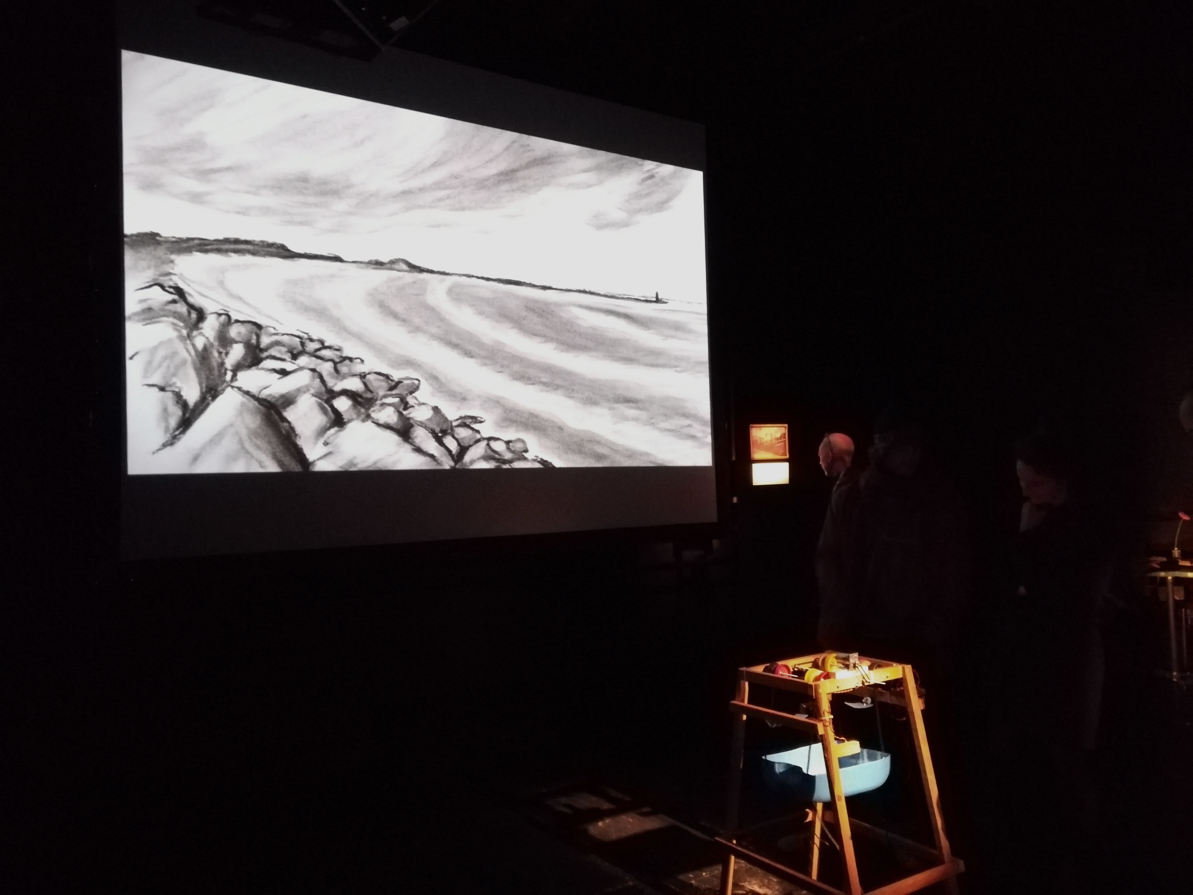 Times Waves, 2019, projected loop (charcoal), framed photo & text, sound machine.